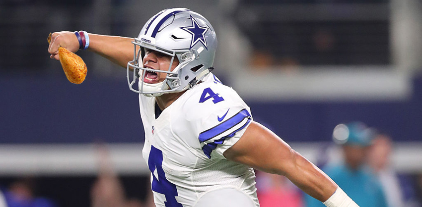 ARLINGTON, TX - JANUARY 15:  Dak Prescott #4 of the Dallas Cowboys celebrates after throwing a touchdown pass during the fourth quarter against the Green Bay Packers in the NFC Divisional Playoff game at AT&T Stadium on January 15, 2017 in Arlington, Texas.  (Photo by Tom Pennington/Getty Images)