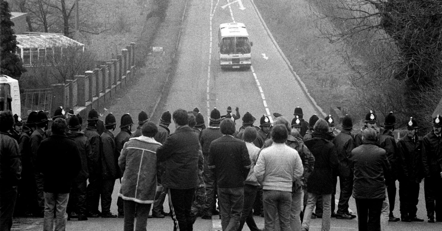 Striking miners from Wales behind a Police line Daw Mill Colliery, 1984 as a coach full of scabs arrive for work, the pickets could not speak to the working miners. Miners Strike Daw Mill Colliery Warwickshire.